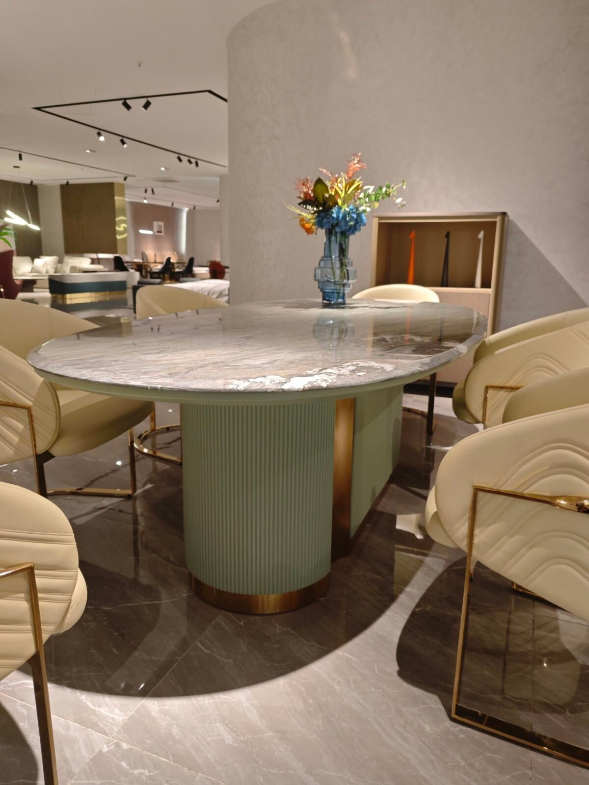 Close-up of blue-gold sand marble surface showing natural veining and color variations with green gold ivory