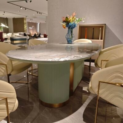 Close-up of blue-gold sand marble surface showing natural veining and color variations with green gold ivory