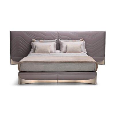 Exquisite Lumina White Leather Bed with white fabric headboard and rose gold hardware.