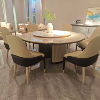 Round turntable dining table in contemporary restaurant with engineered stone dining furniture
