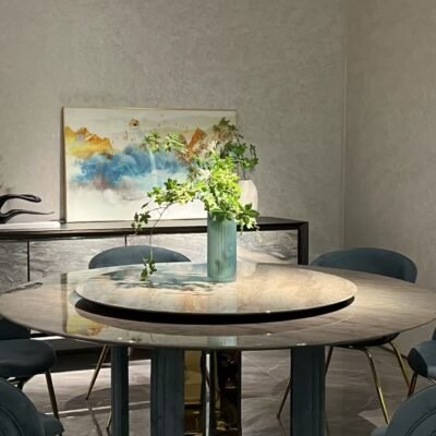 Premium round dining furniture in upscale restaurant with guests using rotating turntable feature