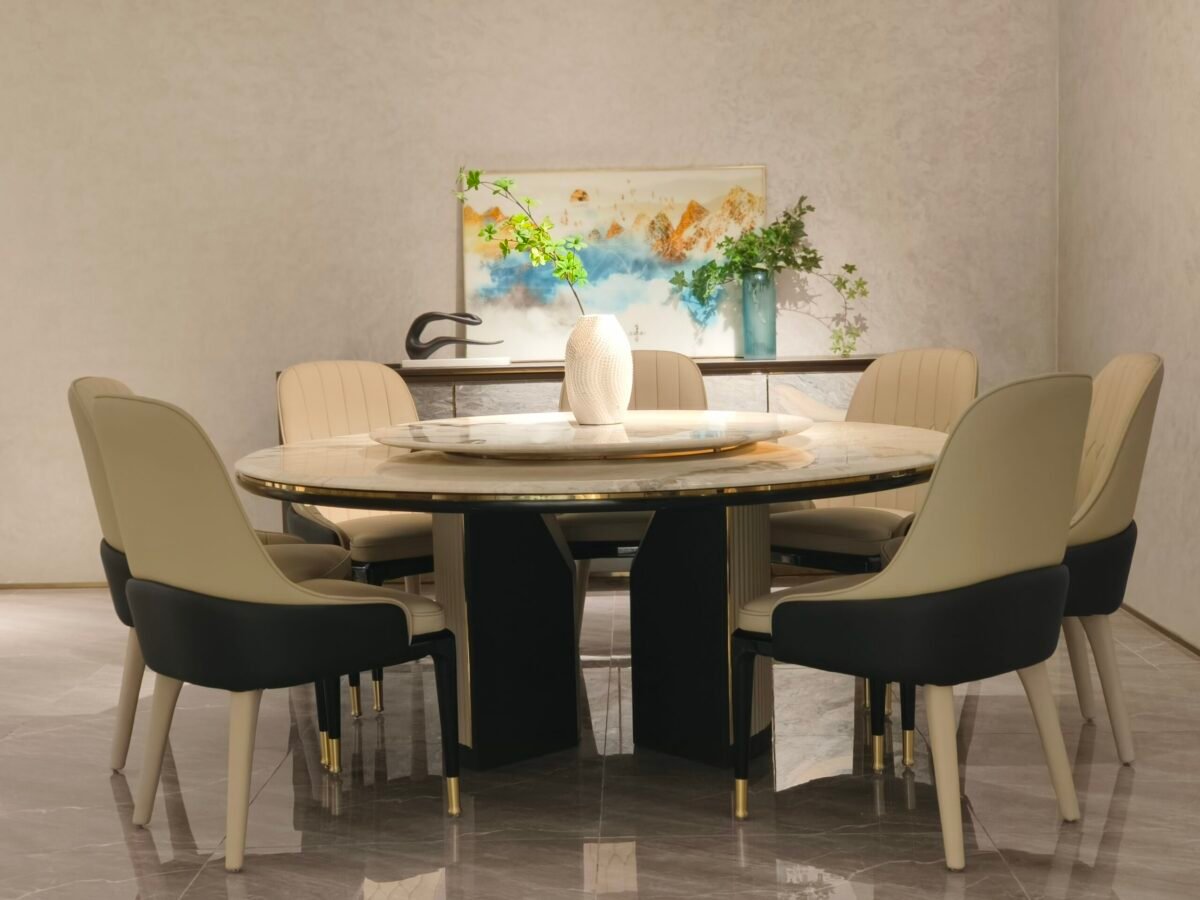 Round turntable dining table in contemporary restaurant with engineered stone dining furniture