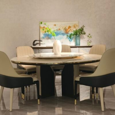 Round turntable dining table in contemporary restaurant with engineered stone dining furniture