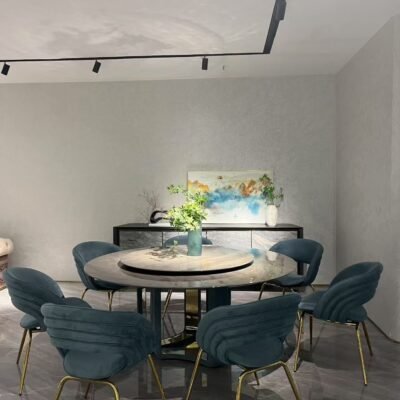 Premium round dining furniture in upscale restaurant with guests using rotating turntable feature