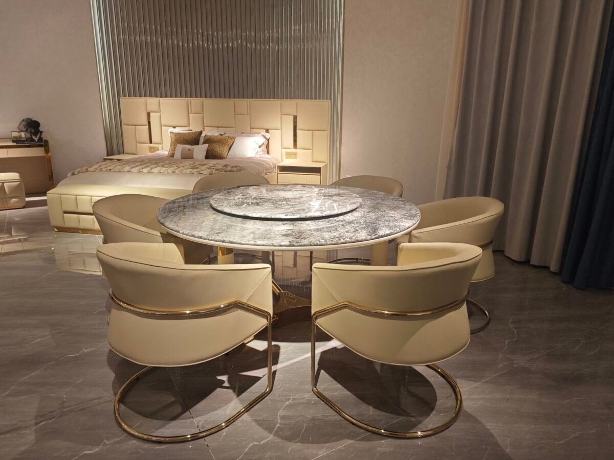 Contemporary marble table in luxury restaurant setting with turntable dining table in use