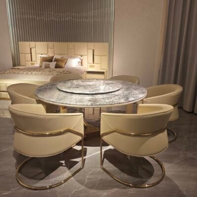 Contemporary marble table in luxury restaurant setting with turntable dining table in use