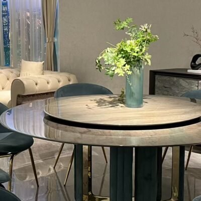 Close-up of Tianshan snow stone surface with natural veining and smoked glass turntable on luxury table