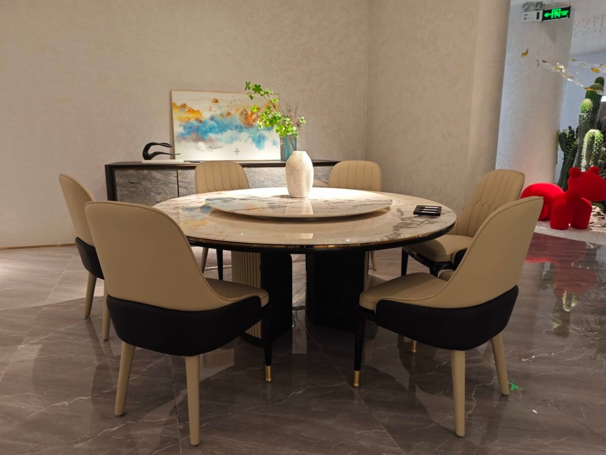 Round turntable dining table in contemporary restaurant with engineered stone dining furniture