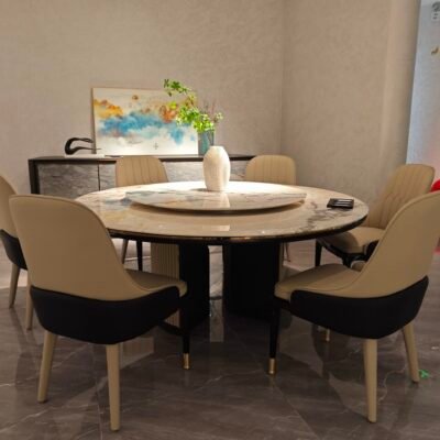 Round turntable dining table in contemporary restaurant with engineered stone dining furniture