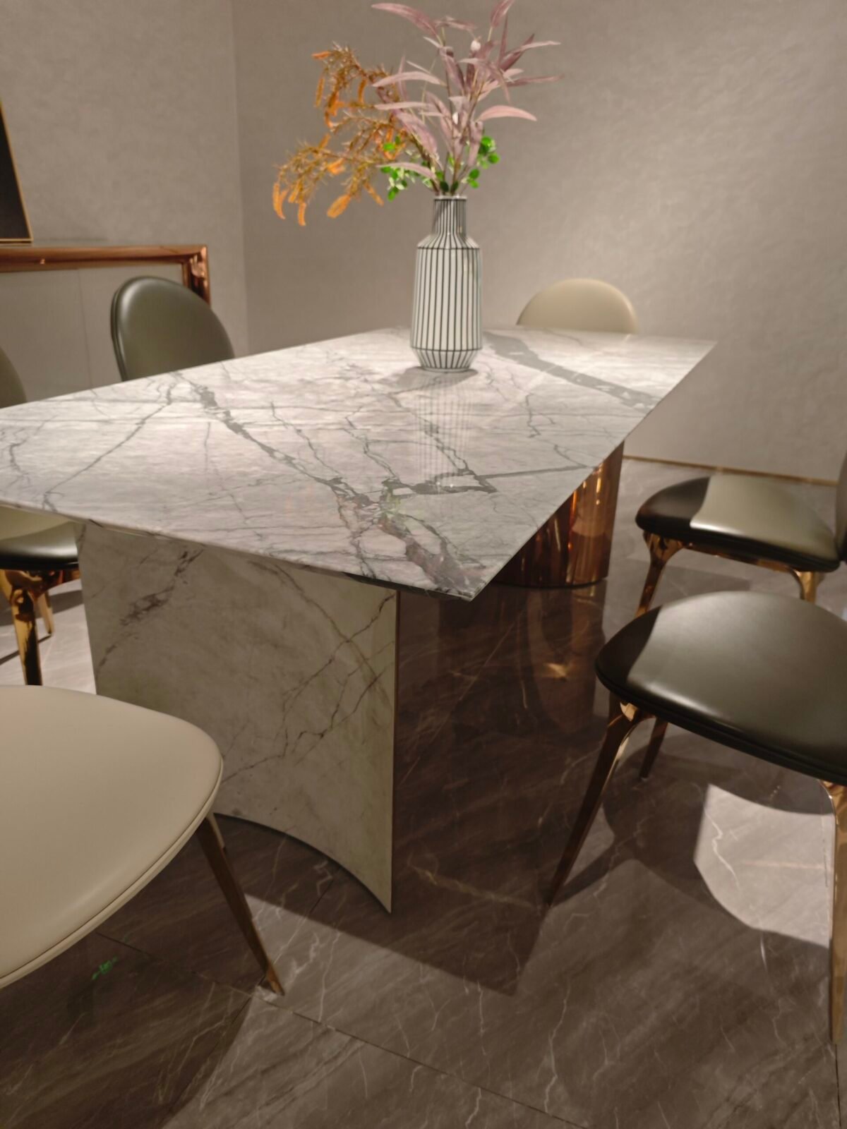 Luxury white marble table detail showing Cold River Snow veining pattern and gold hardware close-up