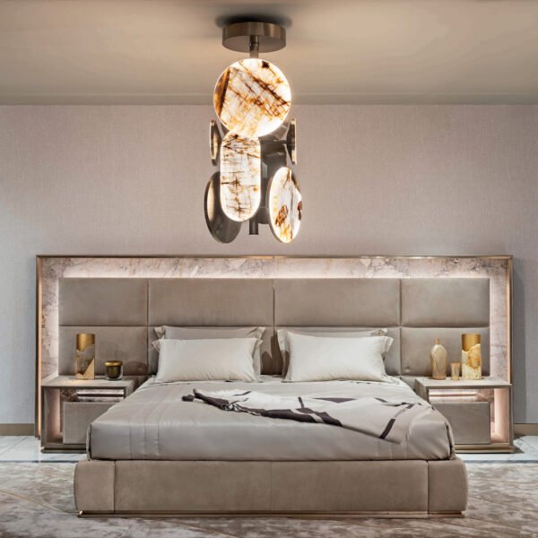 Luxury bed with gold headboard and smart lighting in modern bedroom with matching nightstand
