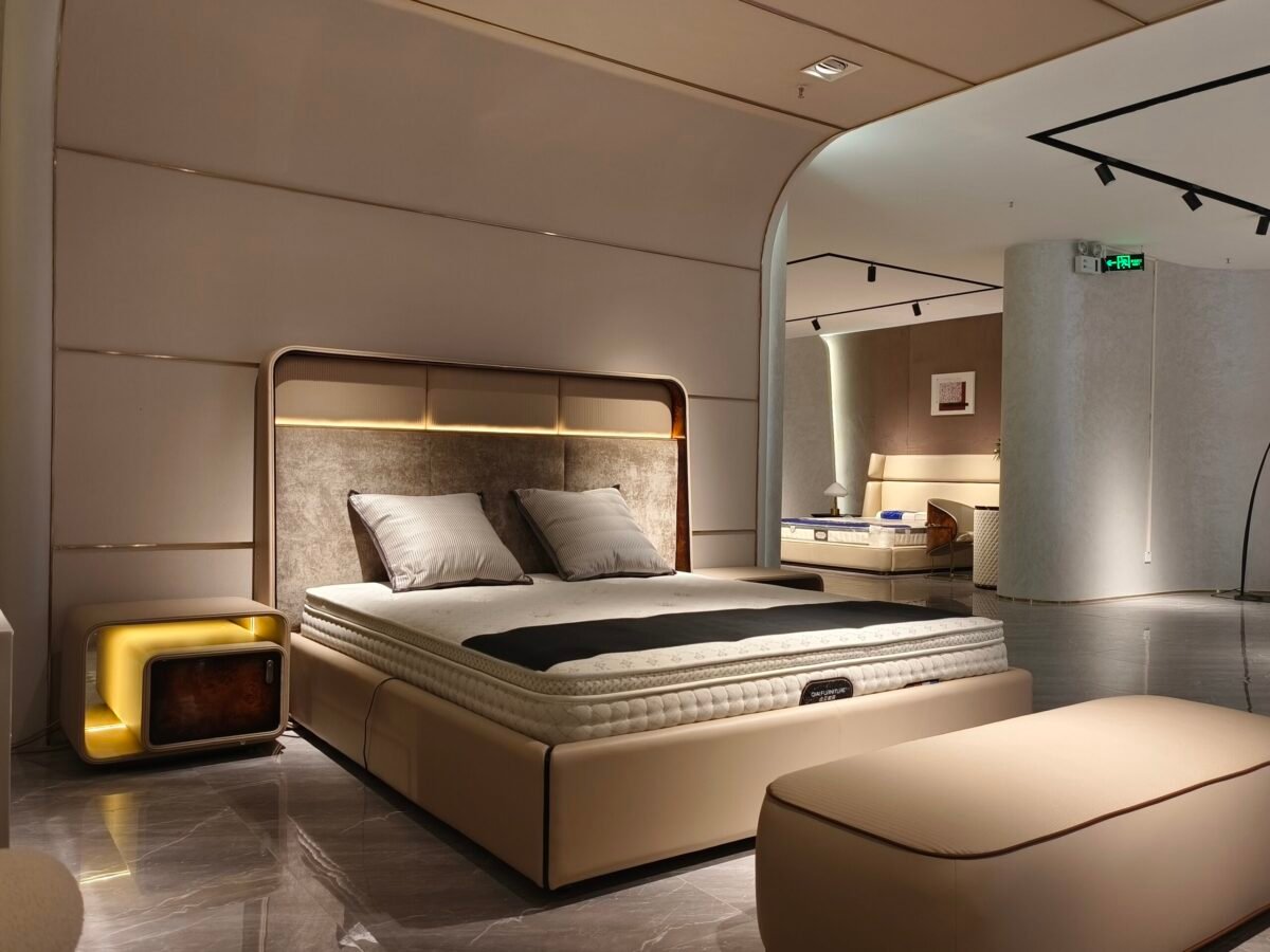 Luxury bedroom bench leather at foot of king-size bed in executive hotel suite