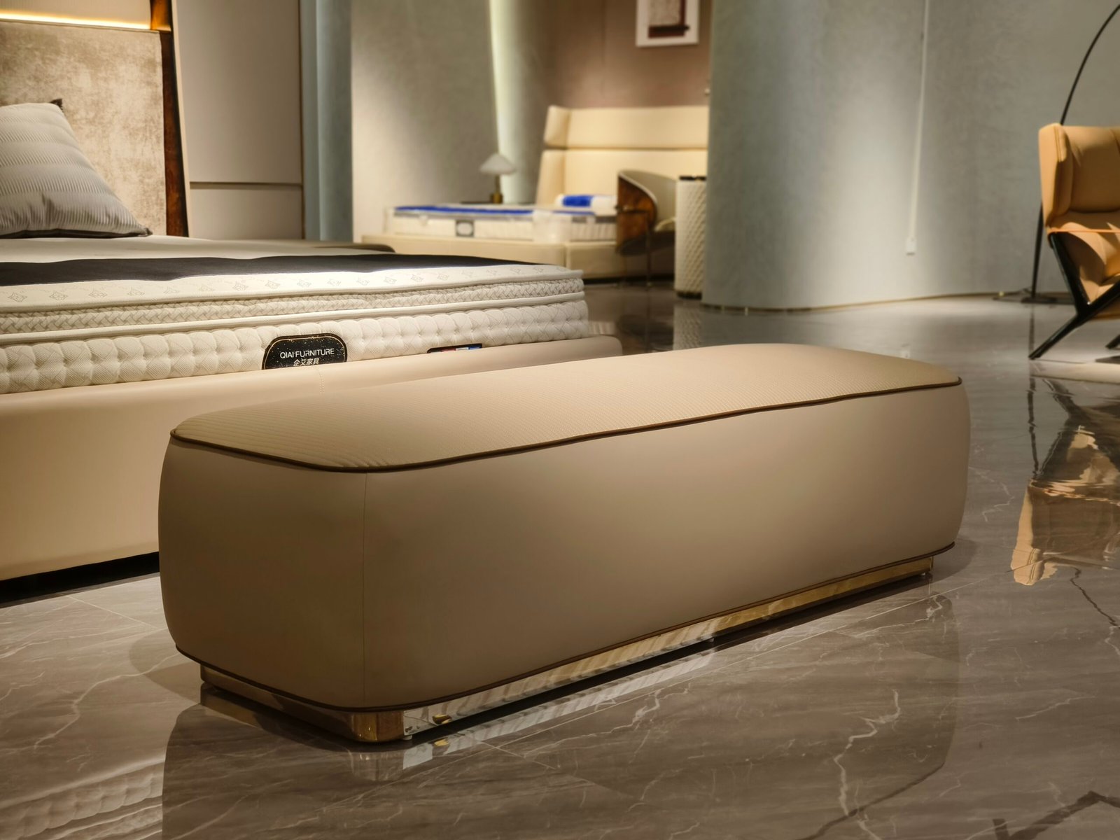 Close-up of genuine leather texture, ribbed semi-leather top, and dark piping detail on beige bench