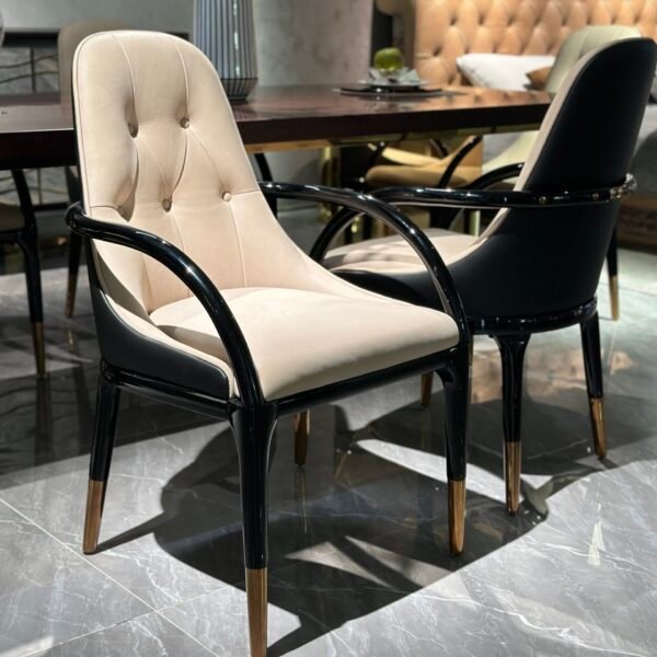 Contemporary upholstered dining chair detail showing velvet texture rose gold hardware and lacquer finish