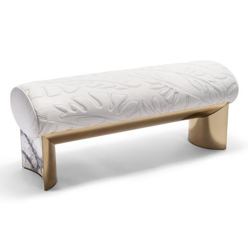 Bedend stool with brushed gold finish featuring quilted frosted cloth upholstery and curved legs