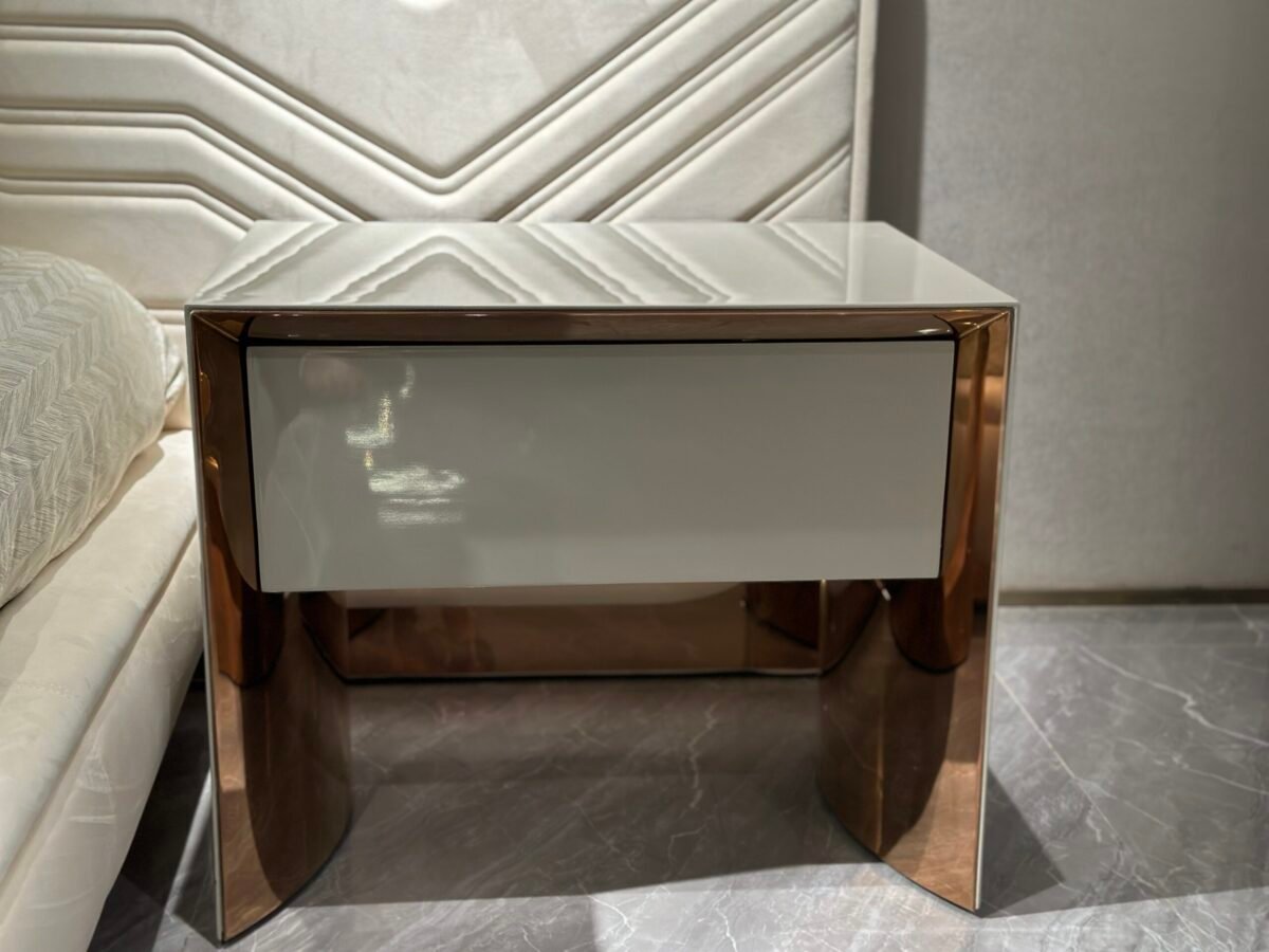 Rose gold nightstand hardware close-up showing luxury drawer handle and mirror finish detail