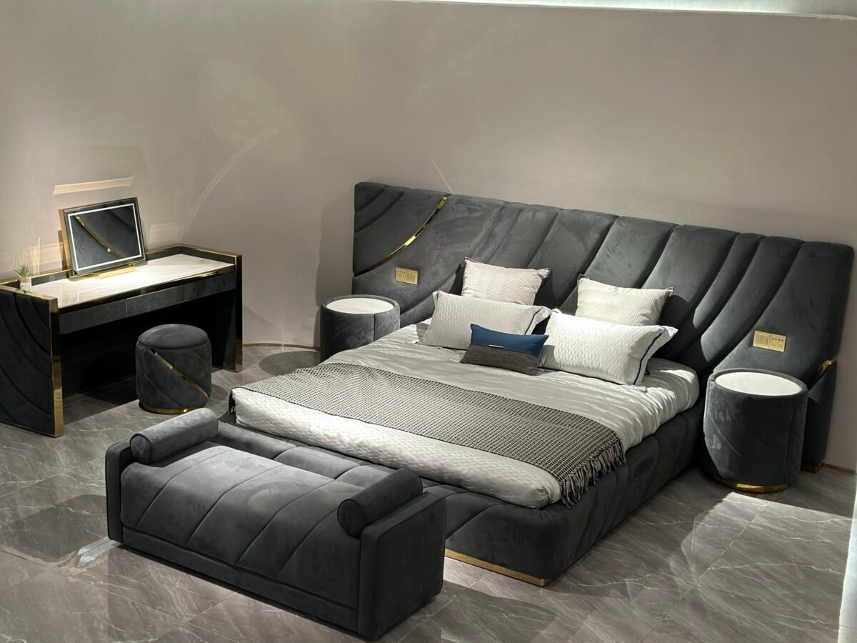 Contemporary bedroom furniture with cylindrical side table styled beside luxury bed