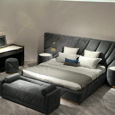 Contemporary bedroom furniture with cylindrical side table styled beside luxury bed