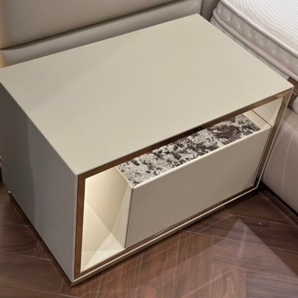 Modern nightstand with drawer styled in contemporary bedroom with luxury bedroom side table