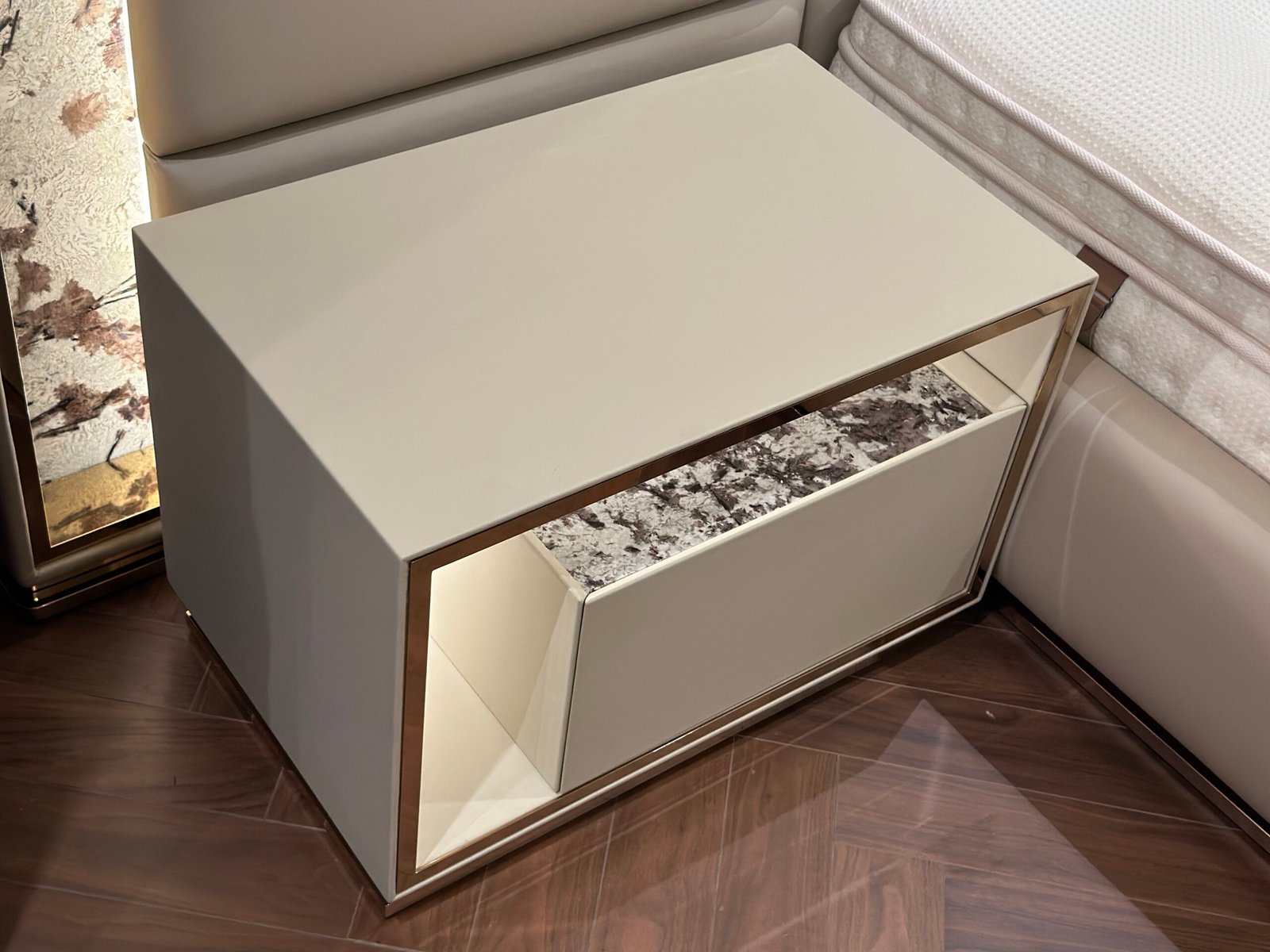 Modern nightstand with drawer styled in contemporary bedroom with luxury bedroom side table