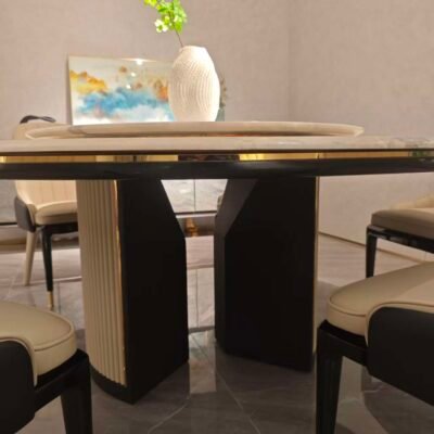 Luxury rotating dining table detail showing Picasso stone veining and turntable mechanism close-up