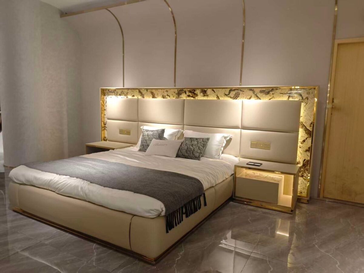 Luxury bed with gold headboard and smart lighting in modern bedroom with matching nightstand