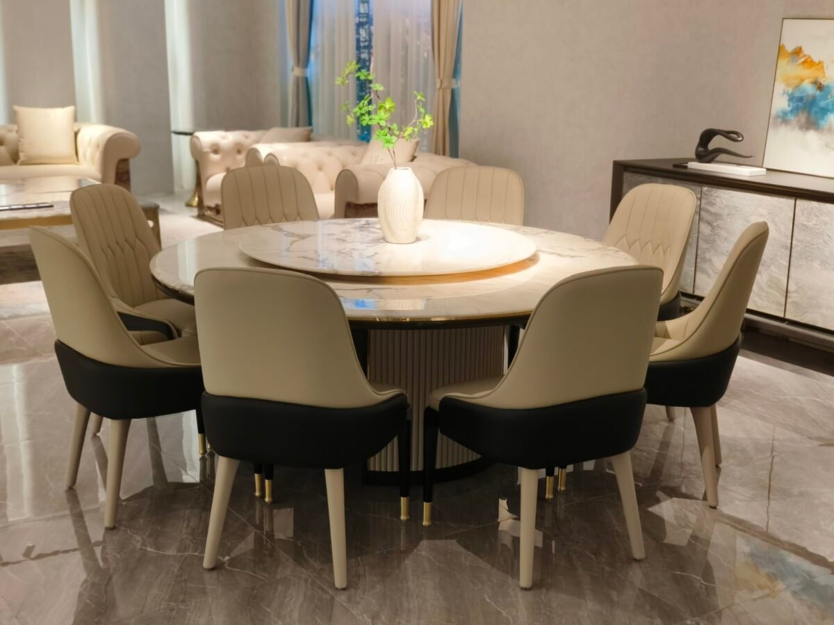 Round turntable dining table in contemporary restaurant with engineered stone dining furniture