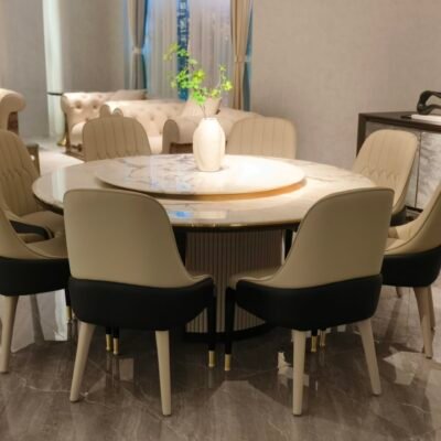 Round turntable dining table in contemporary restaurant with engineered stone dining furniture