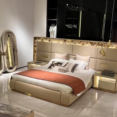 Luxury bed with gold headboard and smart lighting in modern bedroom with matching nightstand