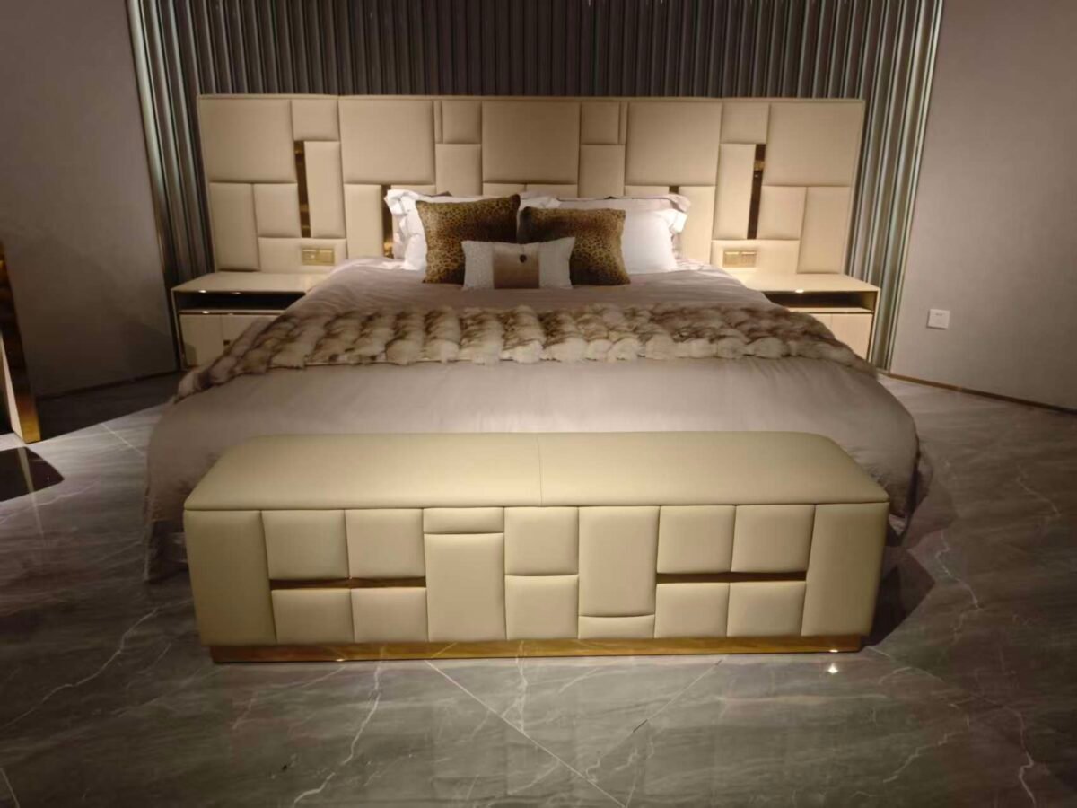 Luxury bedroom bench channel tufted at foot of king-size bed in executive hotel suite