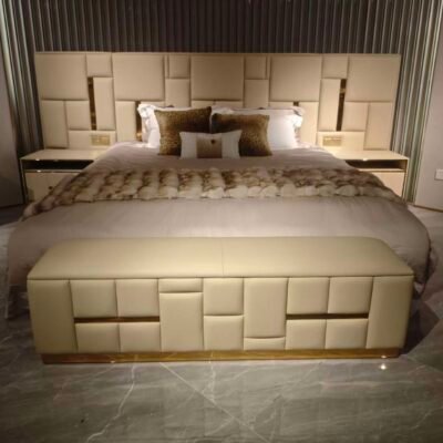 Luxury bedroom bench channel tufted at foot of king-size bed in executive hotel suite