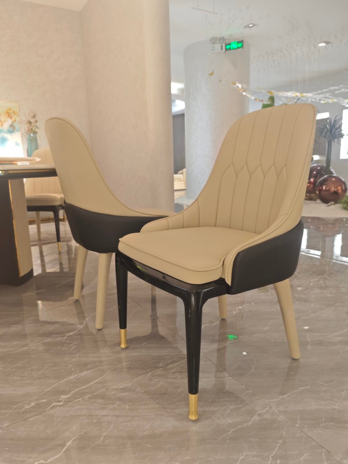 Genuine leather dining chair with modern design featuring premium hardware and sophisticated leather upholstery