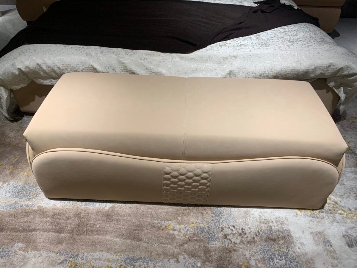 Luxury bedroom bench leather options at foot of king-size bed in boutique hotel suite