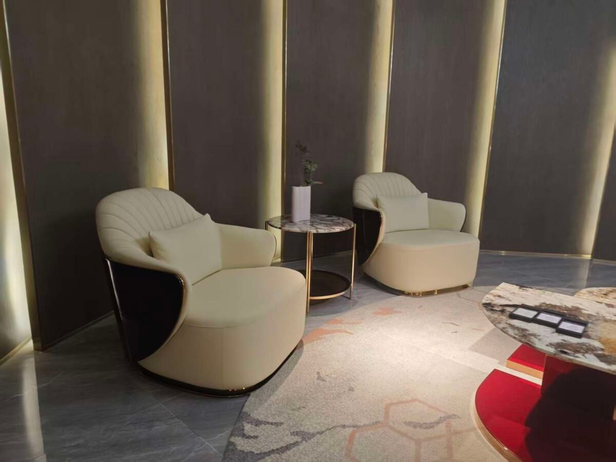 Beige leather lounge chair boutique hotel suite bedroom interior luxury neutral furniture hospitality design contemporary residential sophisticated