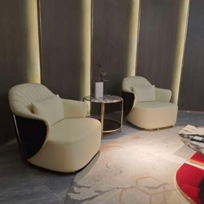 Beige leather lounge chair boutique hotel suite bedroom interior luxury neutral furniture hospitality design contemporary residential sophisticated