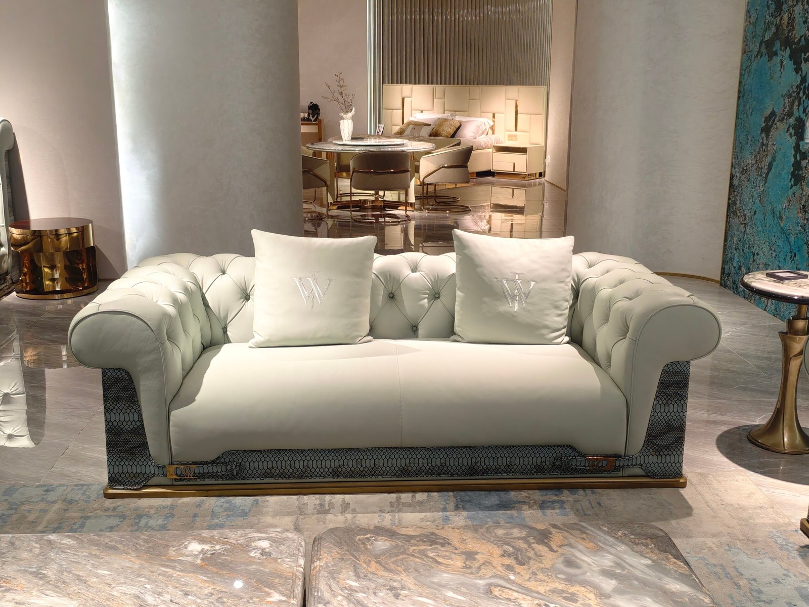 Genuine leather snakeskin trim sofa four and two seater set with blue accent pillow