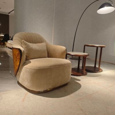 Beige leather lounge chair boutique hotel suite bedroom interior luxury neutral furniture hospitality design contemporary residential sophisticated
