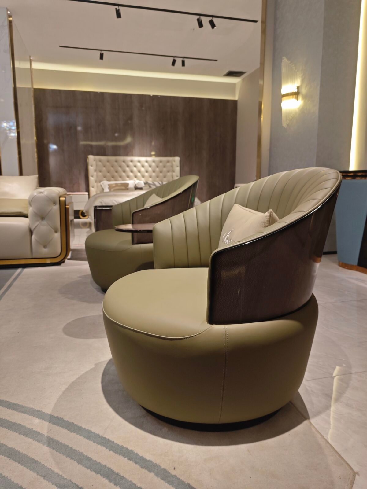 Matte genuine leather close up texture blue armchair grain pattern black pearl wood veneer base detail commercial hospitality furniture