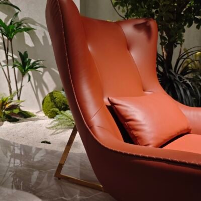 Brown leather upholstery close up texture grain recliner mechanism detail hardware construction commercial hospitality furniture craftsmanship