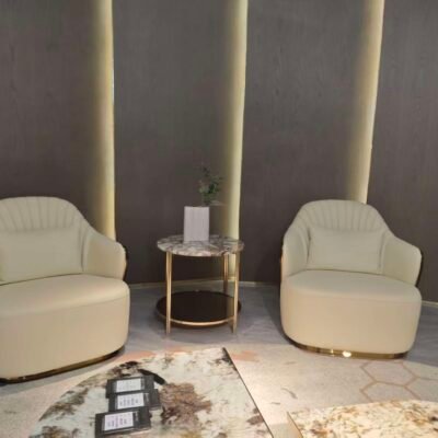 Beige leather lounge chair boutique hotel suite bedroom interior luxury neutral furniture hospitality design contemporary residential sophisticated