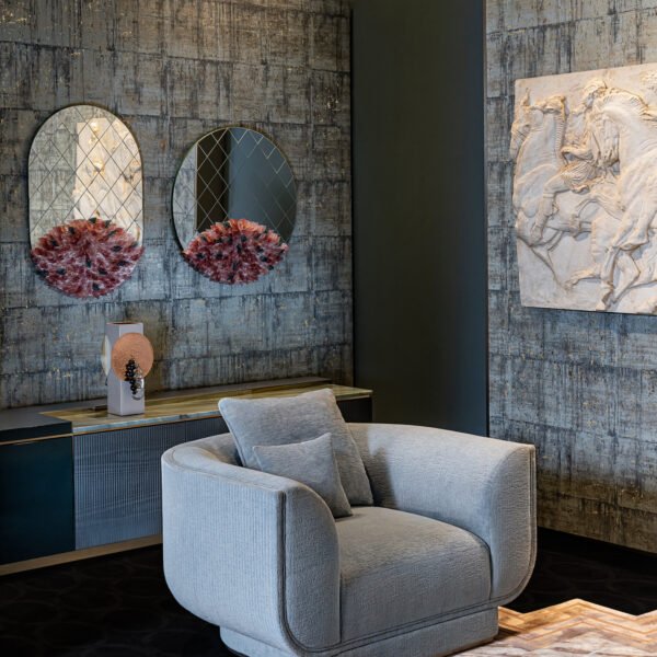 Beige velvet modern chair boutique hotel suite living area luxury wide furniture hospitality interior contemporary residential oversized seating