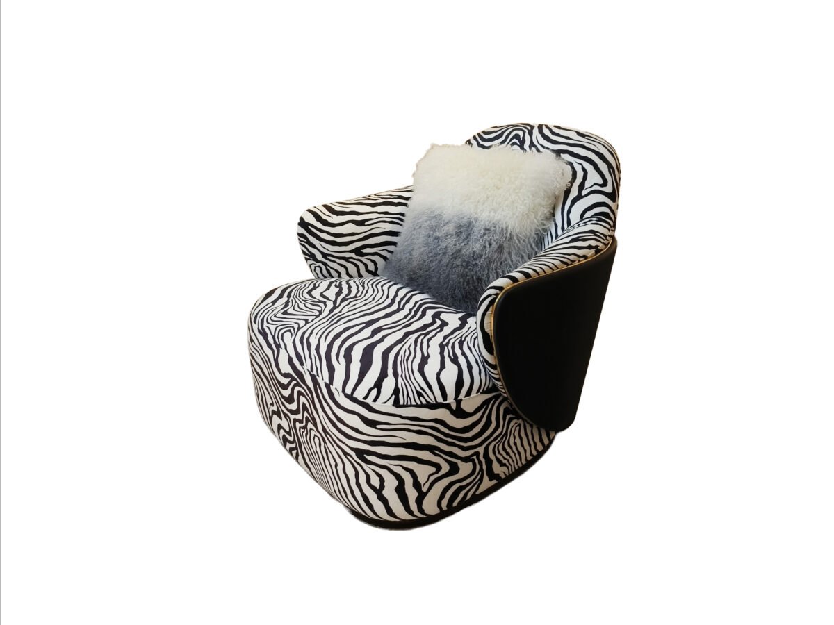 Zebra print lounge chair statement accent hospitality furniture bold pattern luxury commercial design boutique hotel restaurant chair