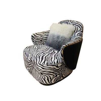 Zebra print lounge chair statement accent hospitality furniture bold pattern luxury commercial design boutique hotel restaurant chair