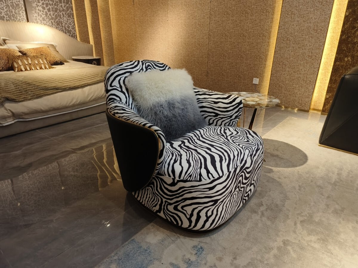 Zebra print lounge chair boutique hotel lobby interior statement furniture bold pattern hospitality design eclectic contemporary social media