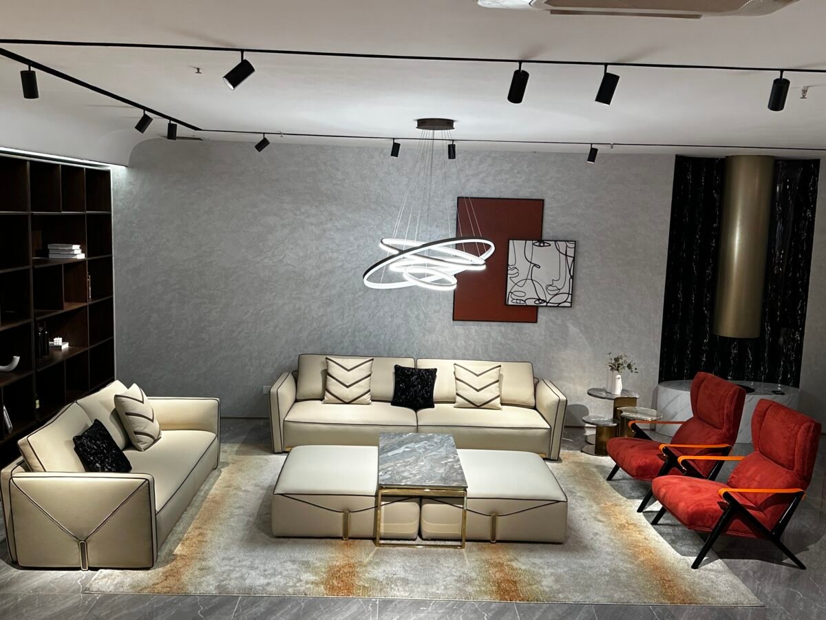 Contemporary home seating furniture – genuine leather luxury sofa in modern styled living room setting