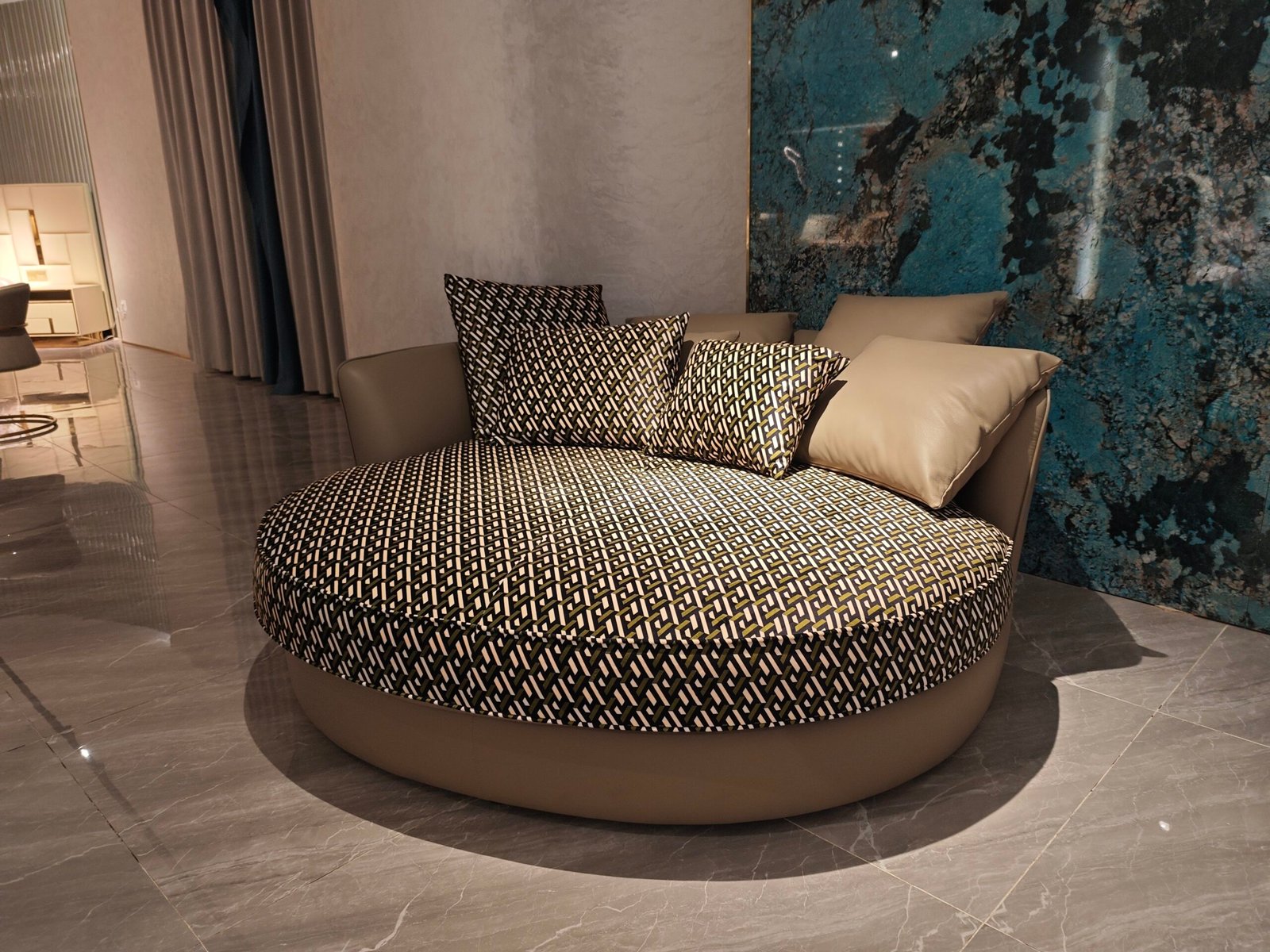 Round recliner lounge furniture boutique hotel lobby interior circular social seating black white pattern hospitality design conversation area