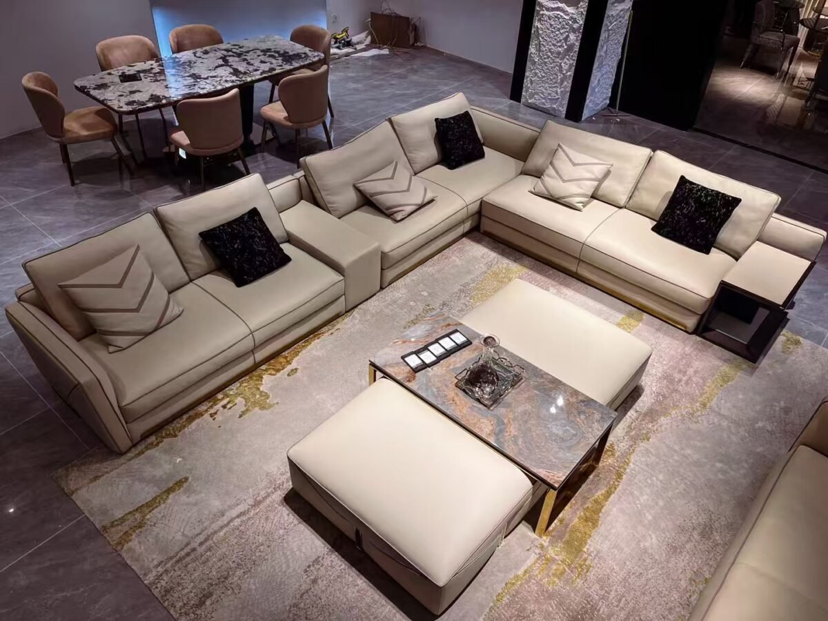 Contemporary home accent pouf styled in elegant living room with white sofa and gold accent decor