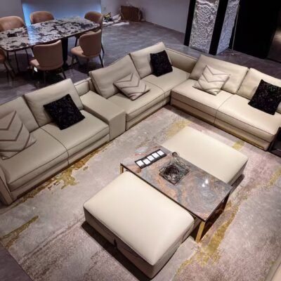 Contemporary home accent pouf styled in elegant living room with white sofa and gold accent decor