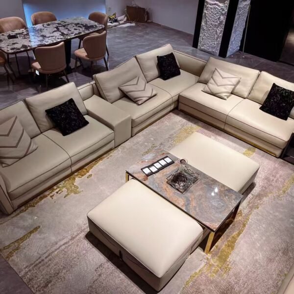 Contemporary home accent pouf styled in elegant living room with white sofa and gold accent decor