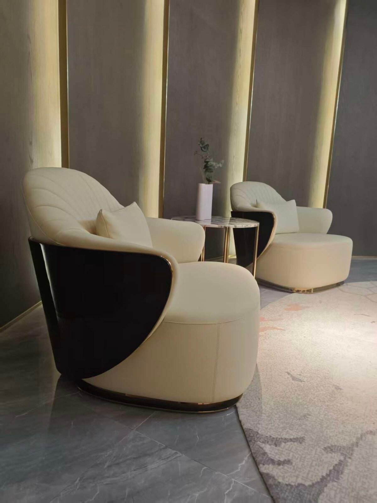 Embroidered back panel close up frosted fabric texture beige leather detail hospitality furniture craftsmanship artisanal textile work